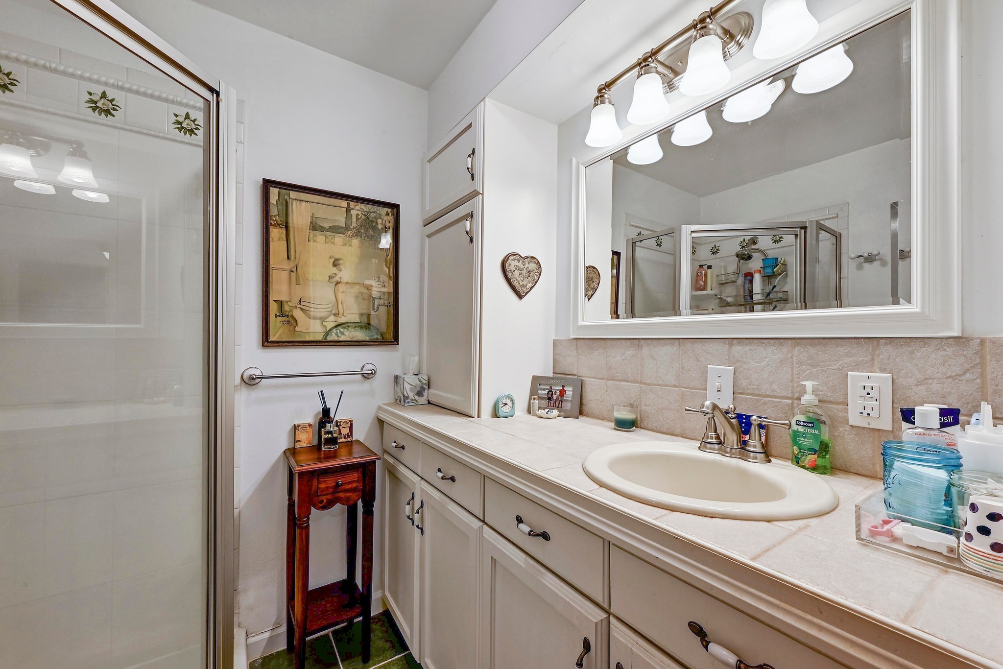 734 Island Drive Bluffton, TX 78607 - Photo 18 of 40 a bathroom with a sink vanity and mirror