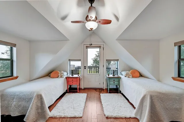 a bedroom with furniture and window