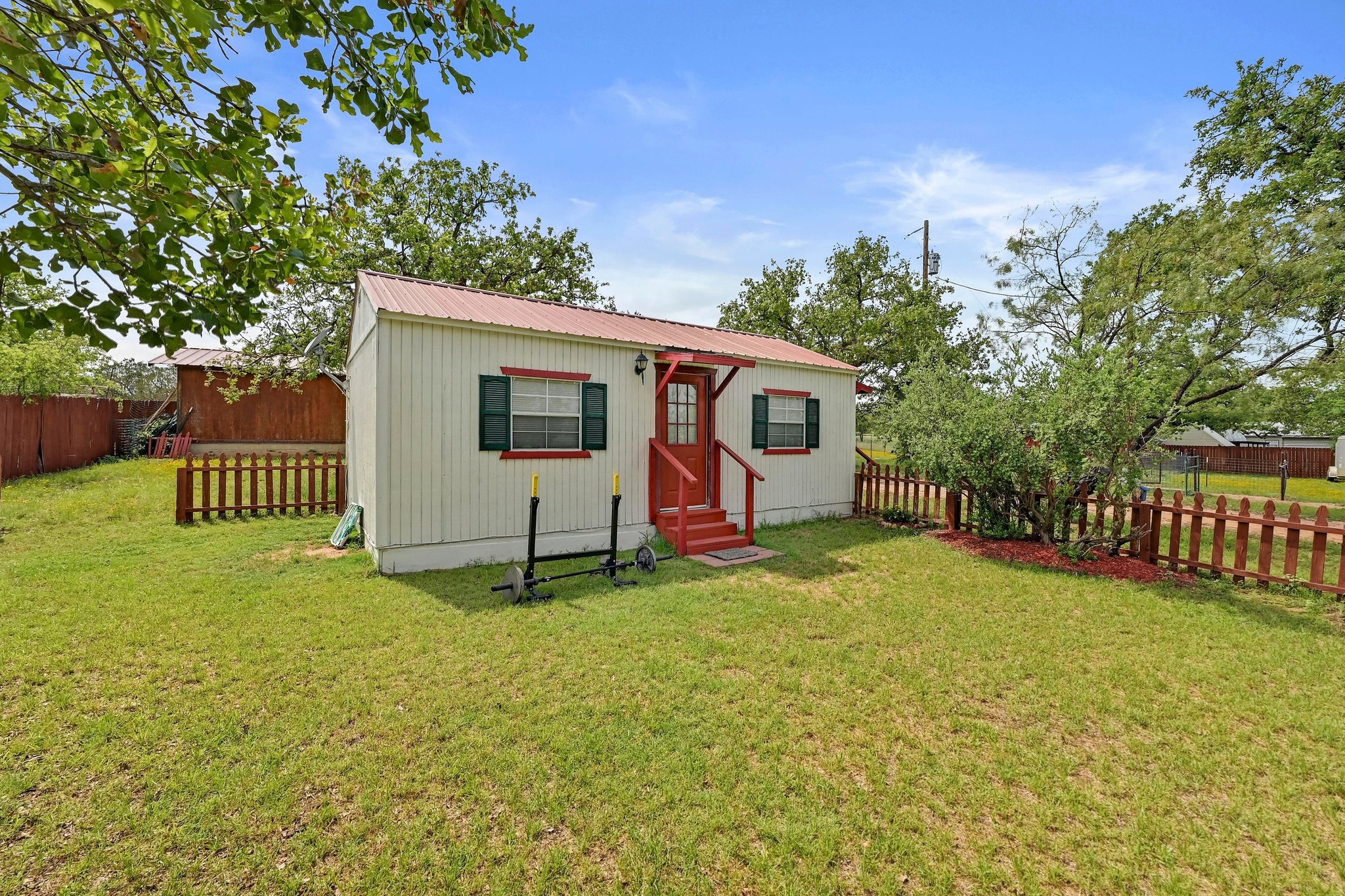 734 Island Drive Bluffton, TX 78607 - Photo 26 of 40 a view of an house with backyard and a tree