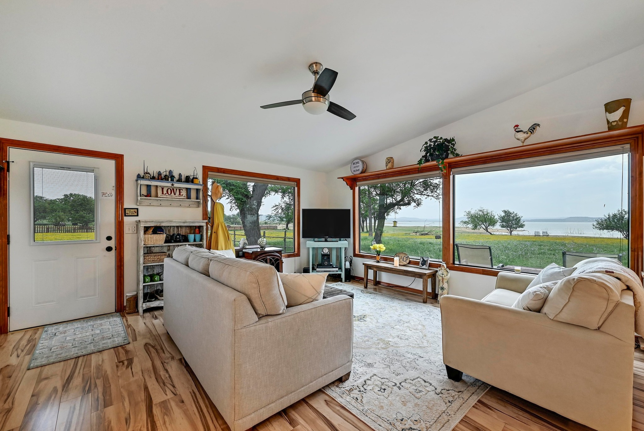 734 Island Drive Bluffton, TX 78607 - Photo 9 of 40 a living room with furniture fireplace and a large window