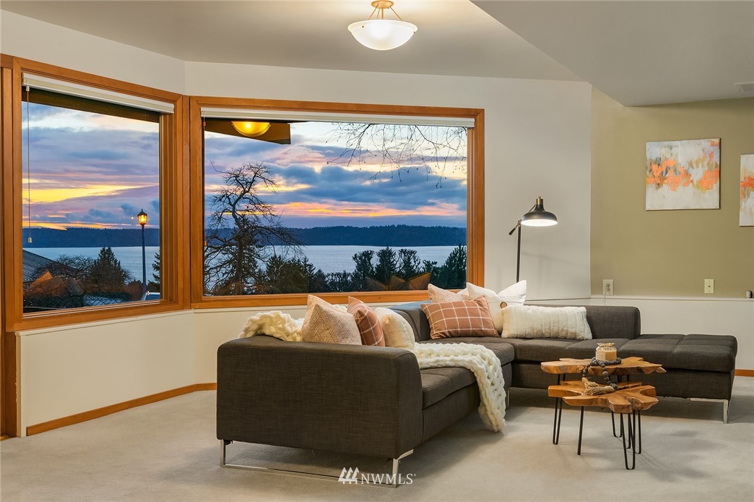 8560 Fauntlee Crest Southwest Seattle, WA 98136 - Photo 18 of 30 a living room with furniture and a large window