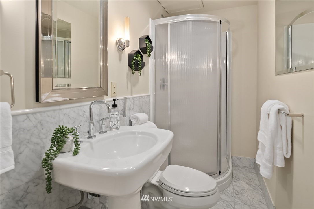 8560 Fauntlee Crest Southwest Seattle, WA 98136 - Photo 23 of 30 a bathroom with a sink toilet and mirror