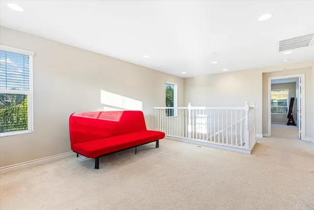 a view of a room with air conditioner and windows