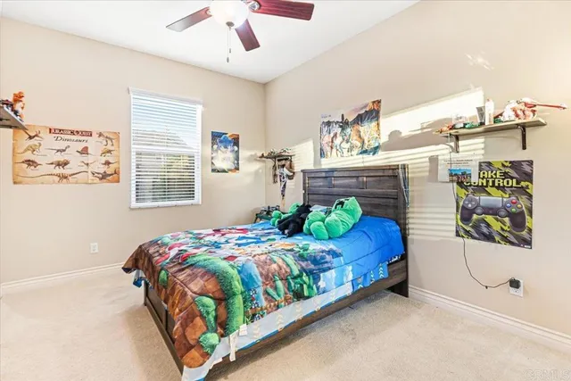 a bedroom with a bed window and wall painting