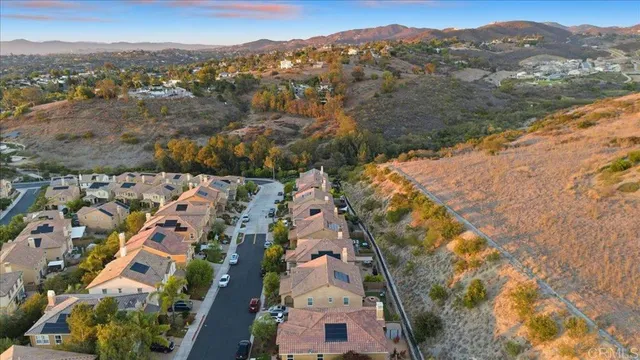 an aerial view of house with yard