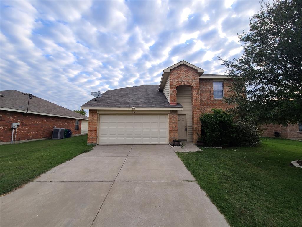 a front view of a house with yard