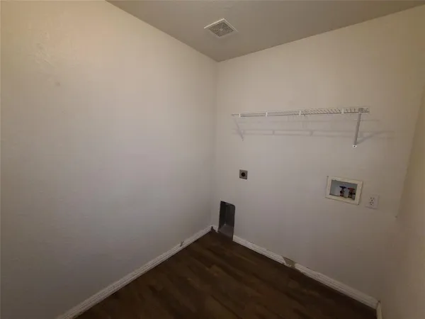 a view of small space with racks on the wall