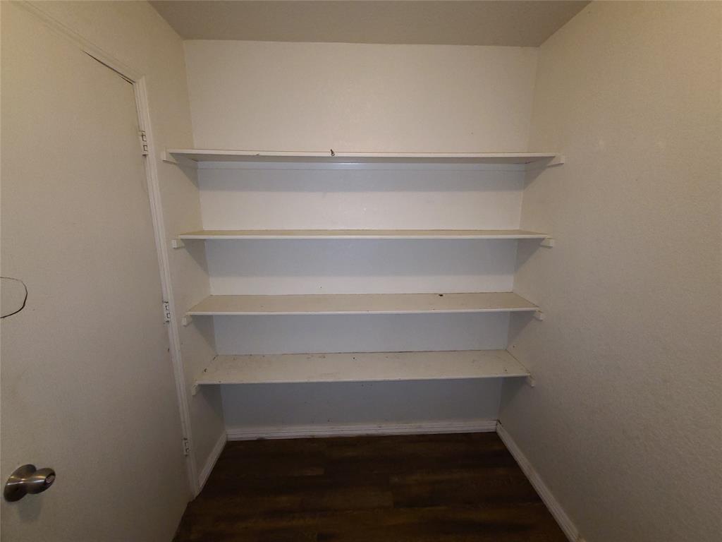 12141 Shine Avenue Rhome, TX 76078 - Photo 14 of 40 a view of walk in closet with empty racks