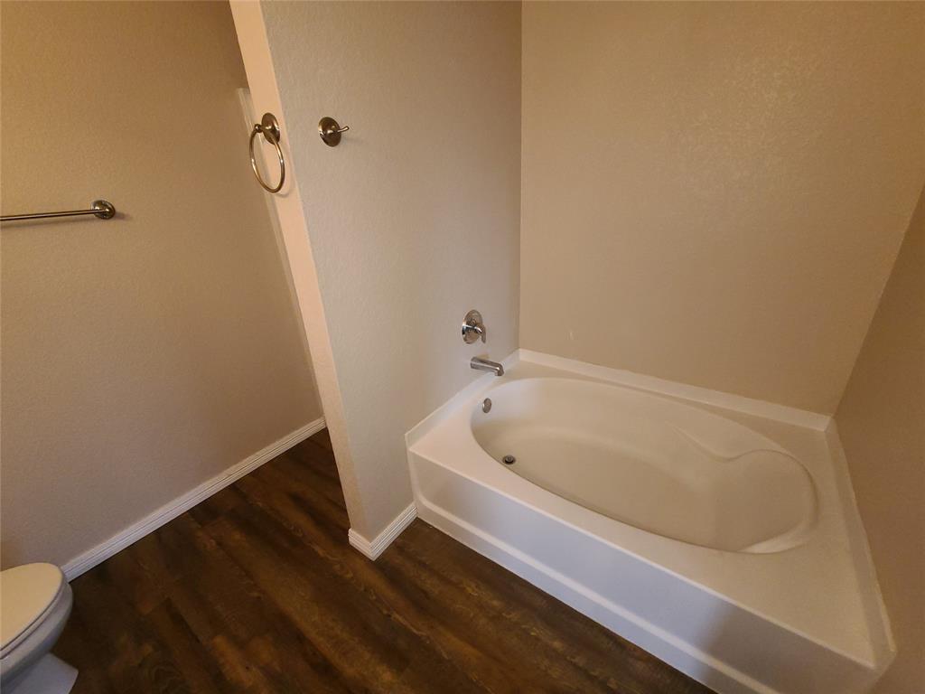 12141 Shine Avenue Rhome, TX 76078 - Photo 17 of 40 a bathroom with a bathtub
