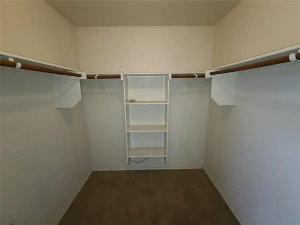 a view of an empty walk in closet