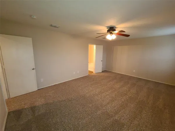 a view of a big room with carpet