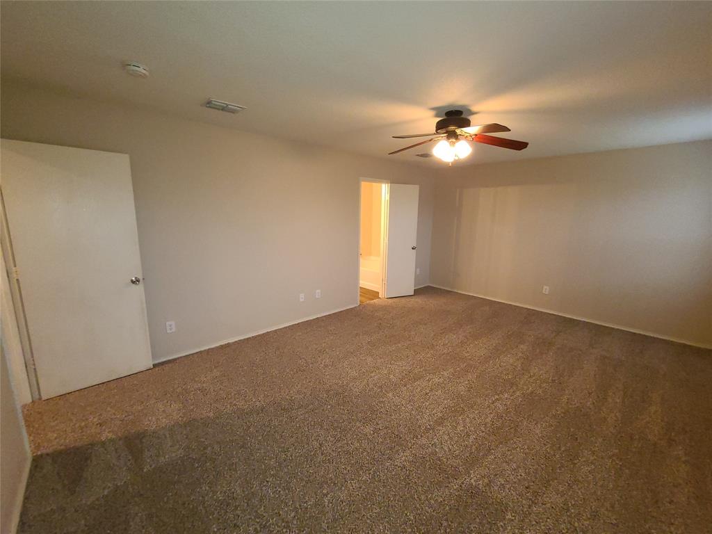 12141 Shine Avenue Rhome, TX 76078 - Photo 22 of 40 a view of a big room with carpet