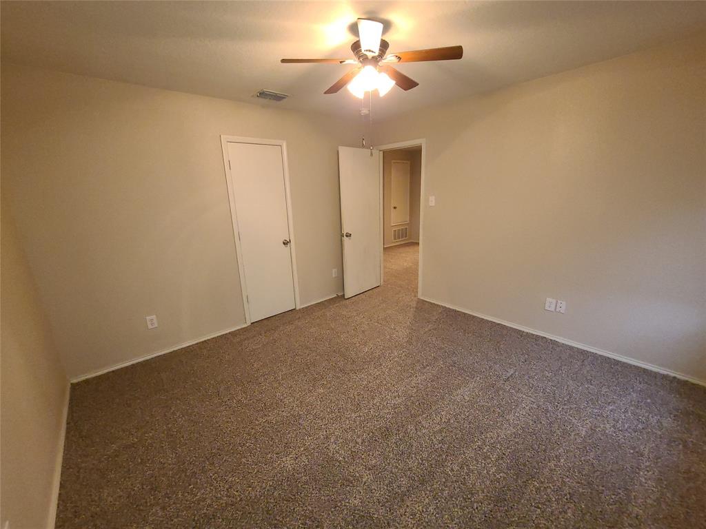 12141 Shine Avenue Rhome, TX 76078 - Photo 29 of 40 a view of a room with a ceiling fan and a window
