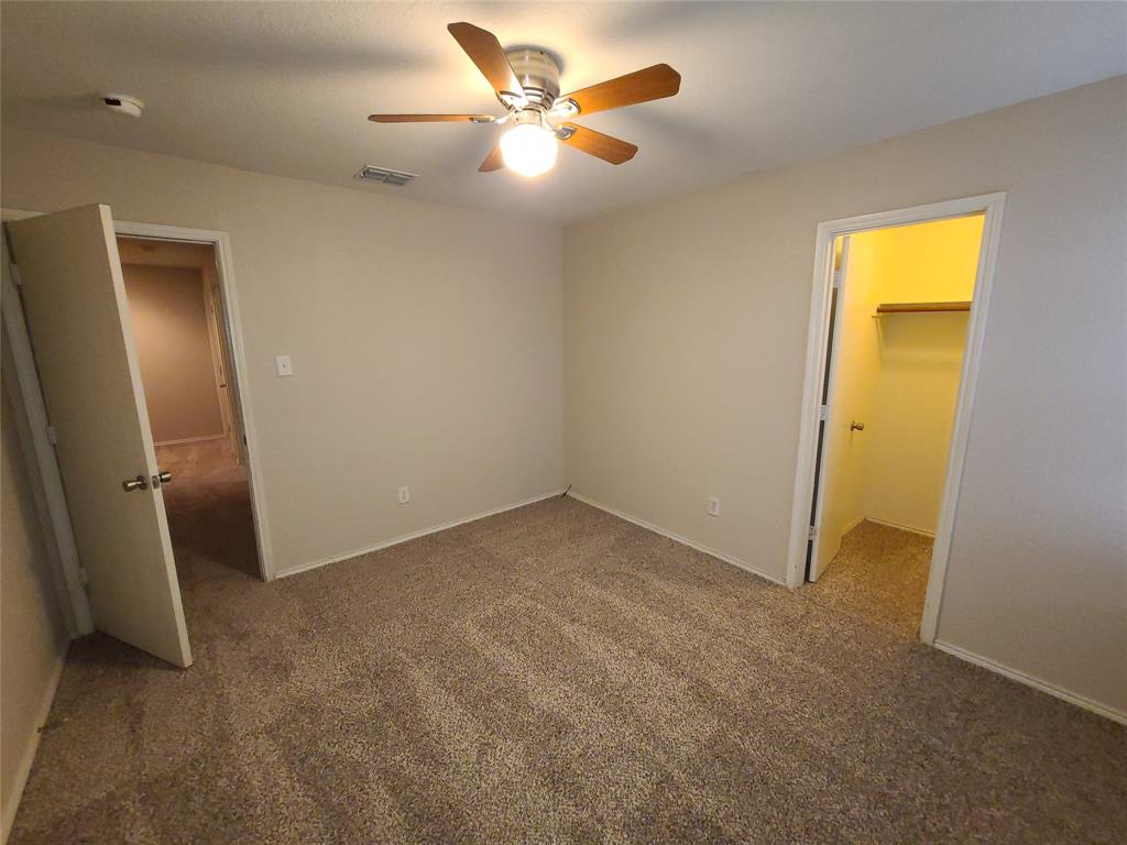 12141 Shine Avenue Rhome, TX 76078 - Photo 34 of 40 a view of an empty room with a fan