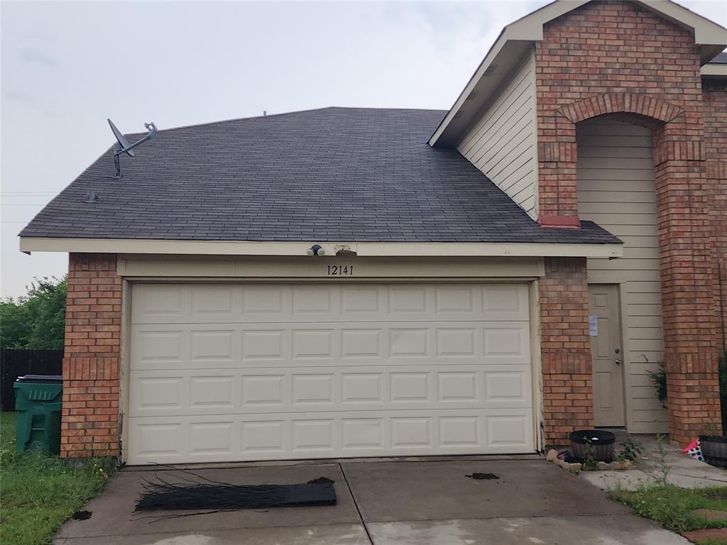 12141 Shine Avenue Rhome, TX 76078 - Photo 40 of 40 a front view of a house with a garage