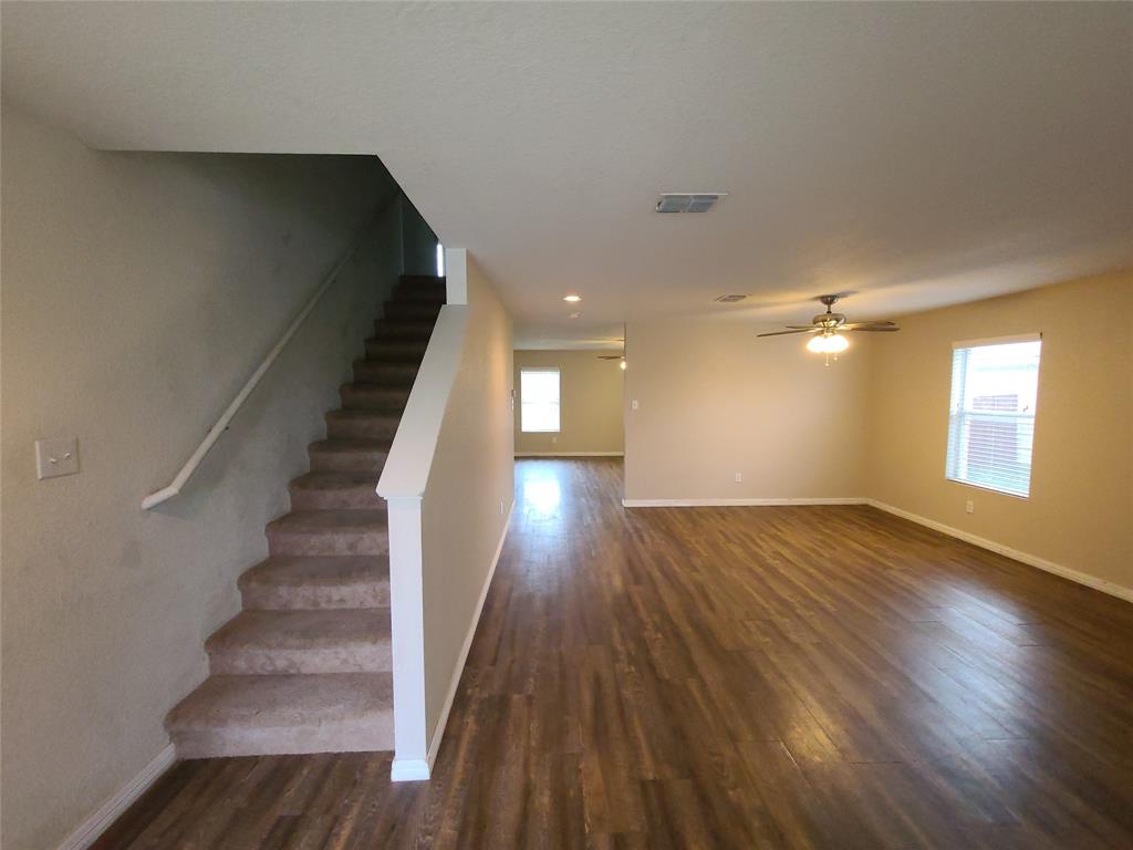12141 Shine Avenue Rhome, TX 76078 - Photo 7 of 40 wooden floor in an empty room with a window