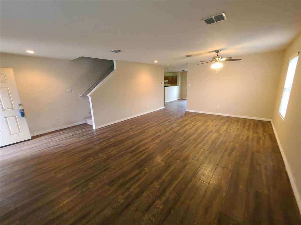 12141 Shine Avenue Rhome, TX 76078 - Photo 8 of 40 wooden floor in an empty room with a window