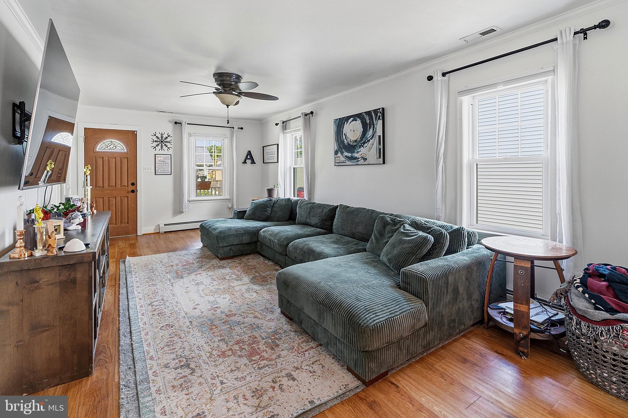 15 South Clinton Avenue Maple Shade, NJ 08052 - Photo 6 of 29 a living room with furniture and a flat screen tv