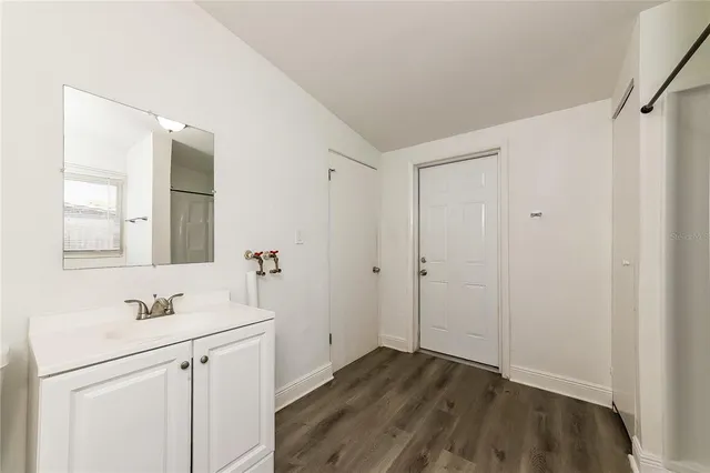 a bathroom with a sink and a mirror