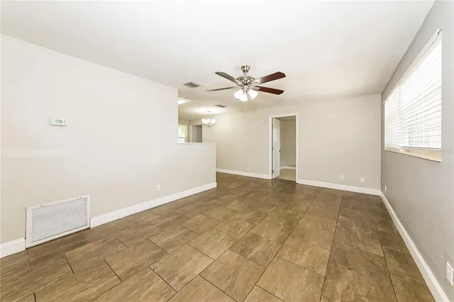 a view of an empty room with a window