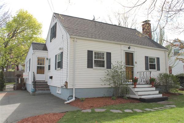 54 School Street Lexington, MA 02421 - Photo 1 of 16 a view of a white house with a small yard and large tree