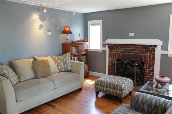 54 School Street Lexington, MA 02421 - Photo 3 of 16 a living room with furniture and a fireplace