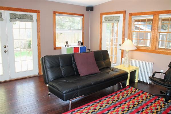 54 School Street Lexington, MA 02421 - Photo 6 of 16 a living room with furniture and a window