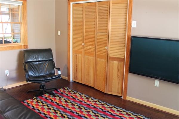 54 School Street Lexington, MA 02421 - Photo 8 of 16 a living room with a chair and a potted plant