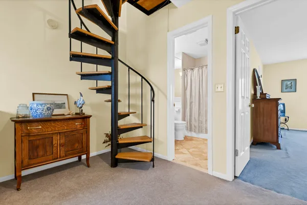 a view of entryway with workspace and stairs