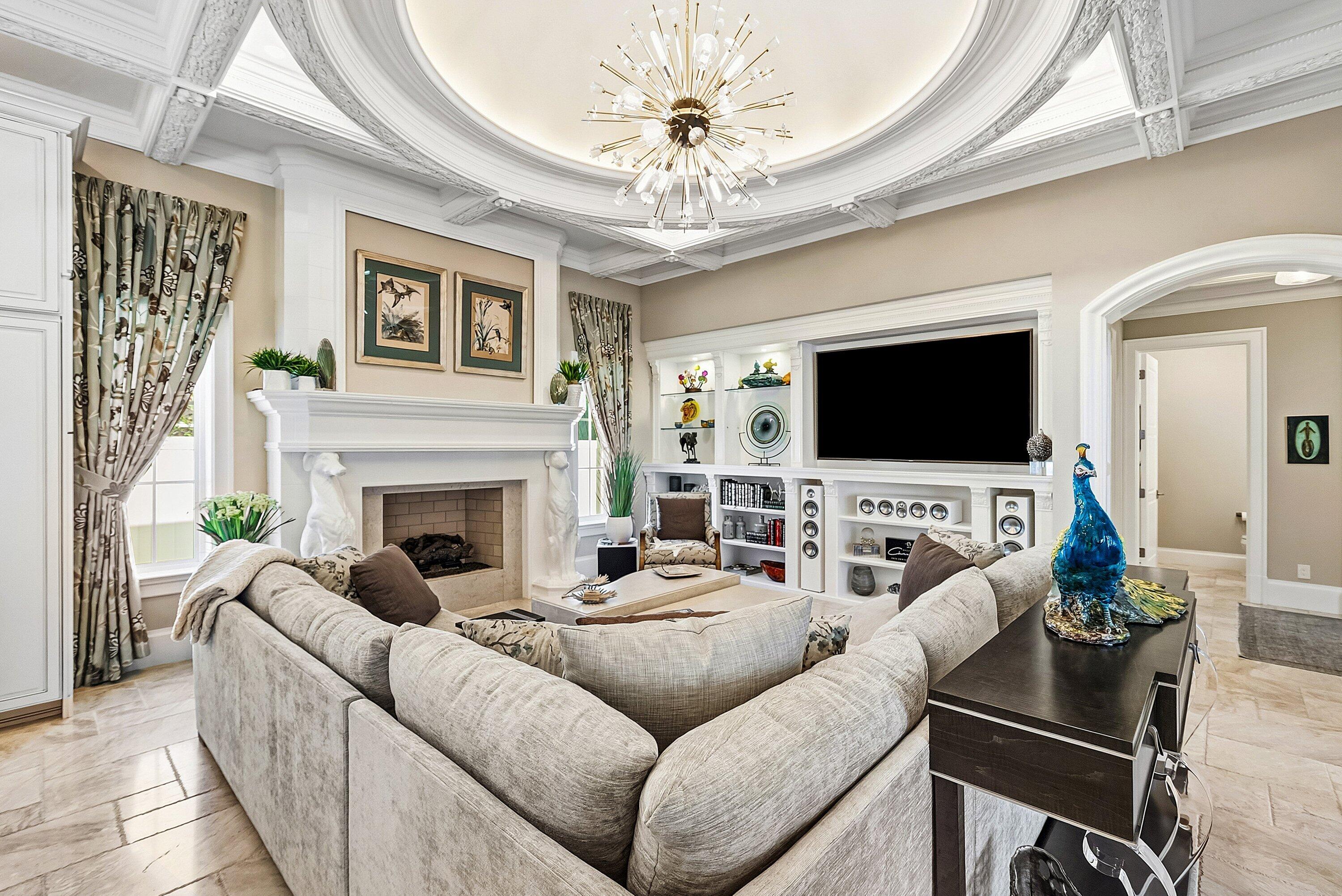 201 Northeast 3rd Court Boca Raton, FL 33432 - Photo 12 of 84 a living room with furniture a flat screen tv and a chandelier