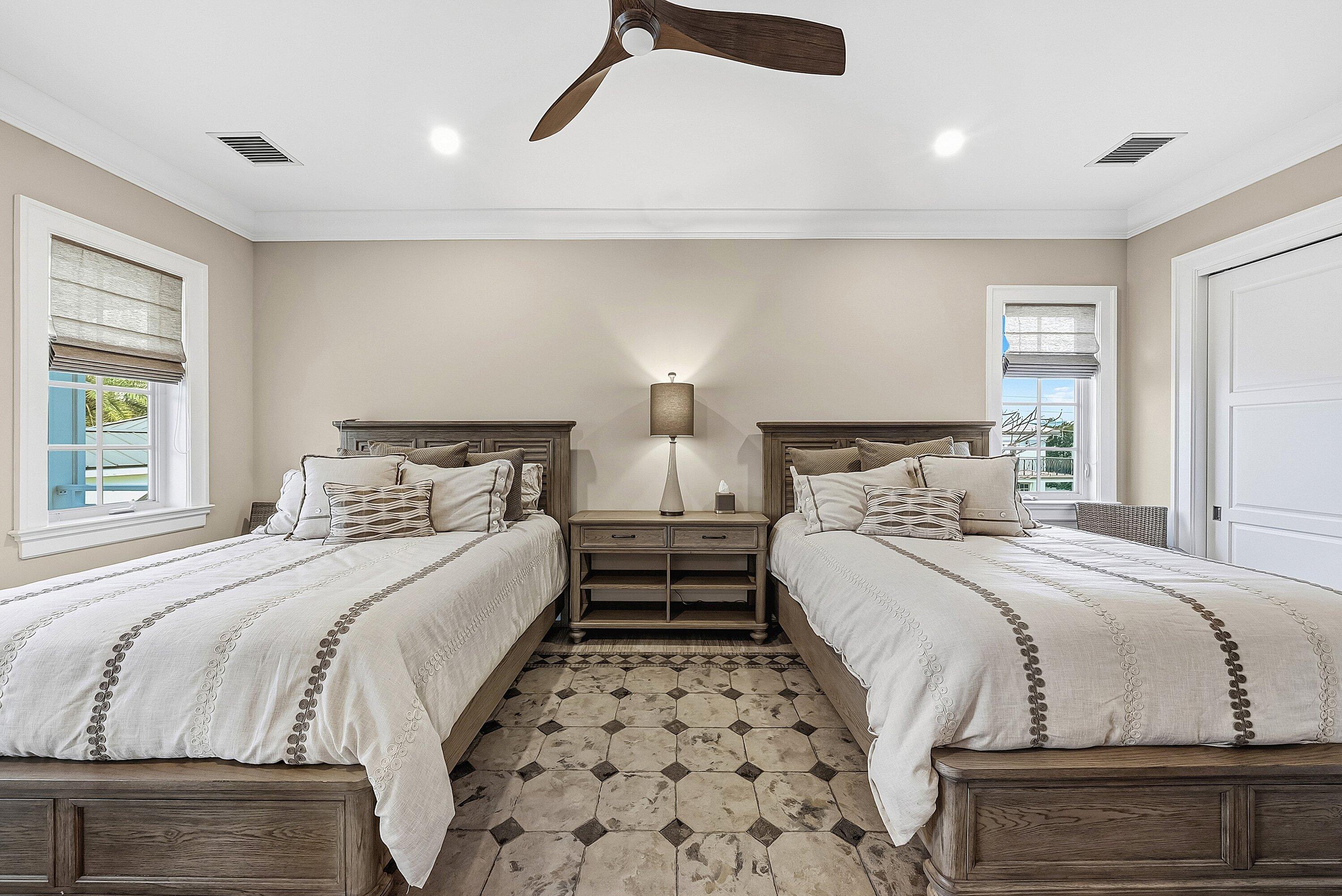 201 Northeast 3rd Court Boca Raton, FL 33432 - Photo 21 of 84 a bedroom with double bed and a night stand