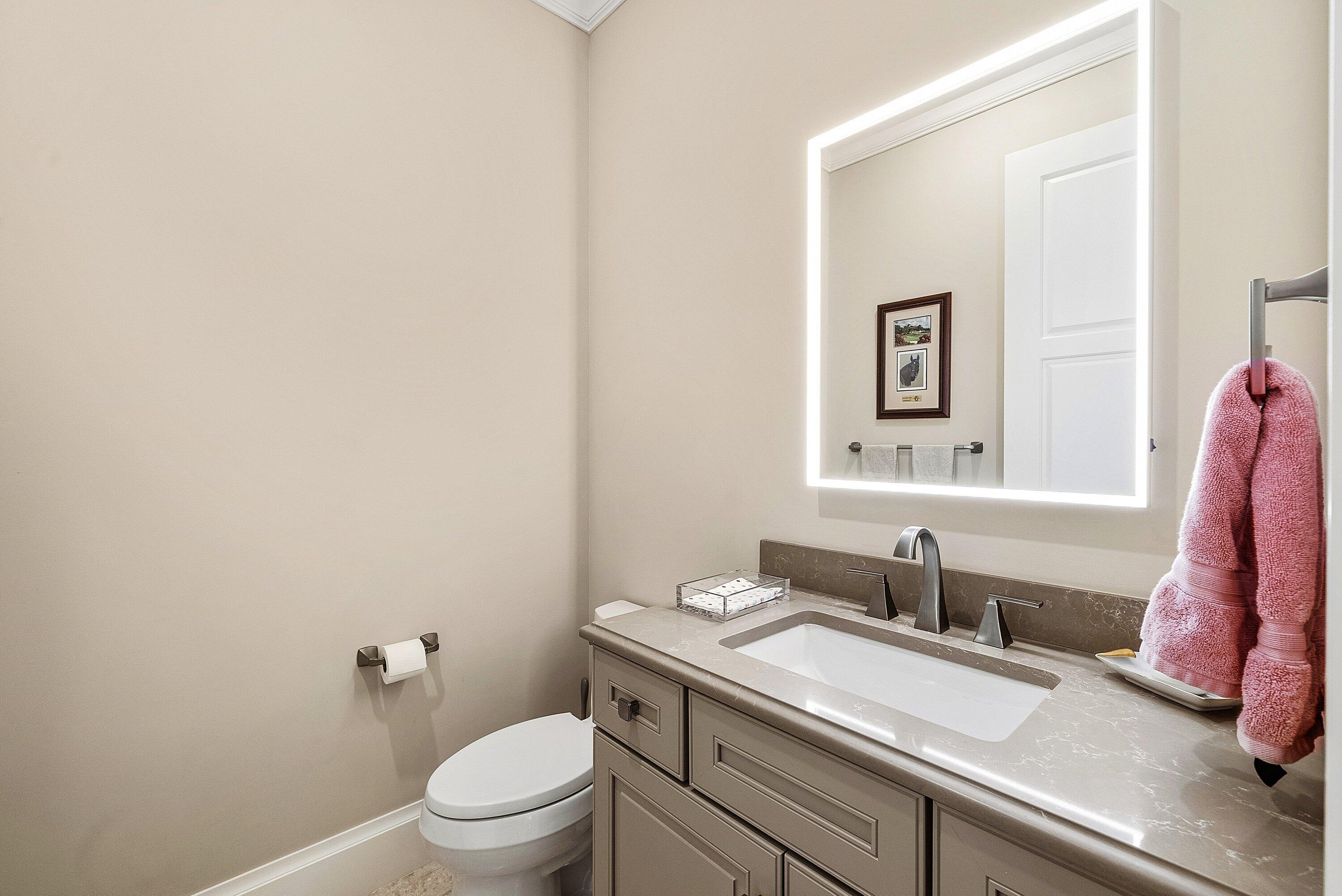 201 Northeast 3rd Court Boca Raton, FL 33432 - Photo 28 of 84 a bathroom with a granite countertop sink and a toilet