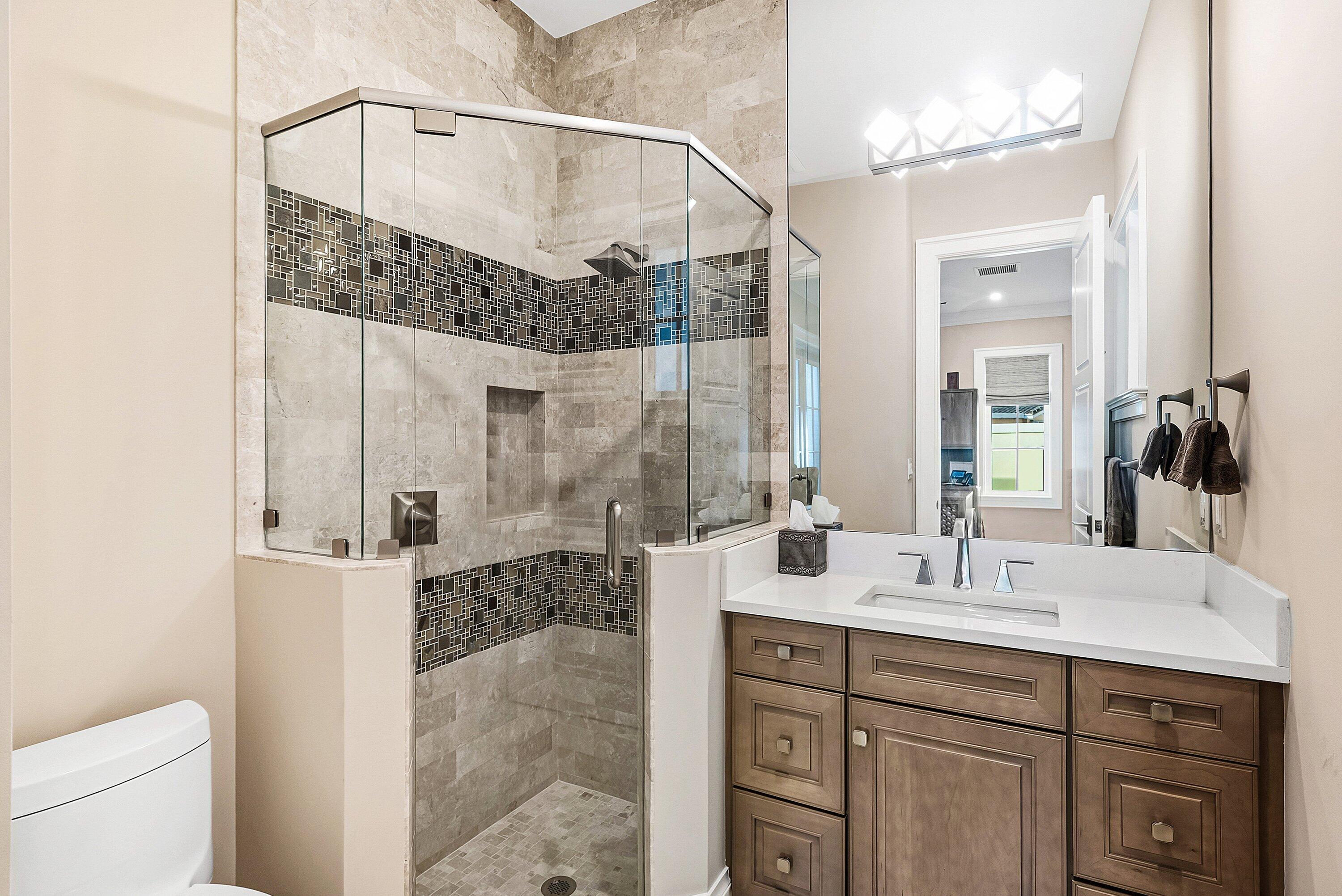 201 Northeast 3rd Court Boca Raton, FL 33432 - Photo 30 of 84 a bathroom with a double vanity sink mirror and shower