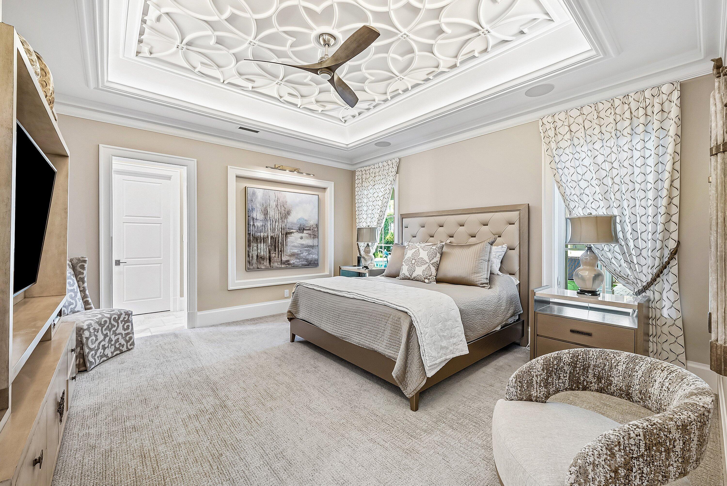 201 Northeast 3rd Court Boca Raton, FL 33432 - Photo 32 of 84 a spacious bedroom with a large bed and a couch