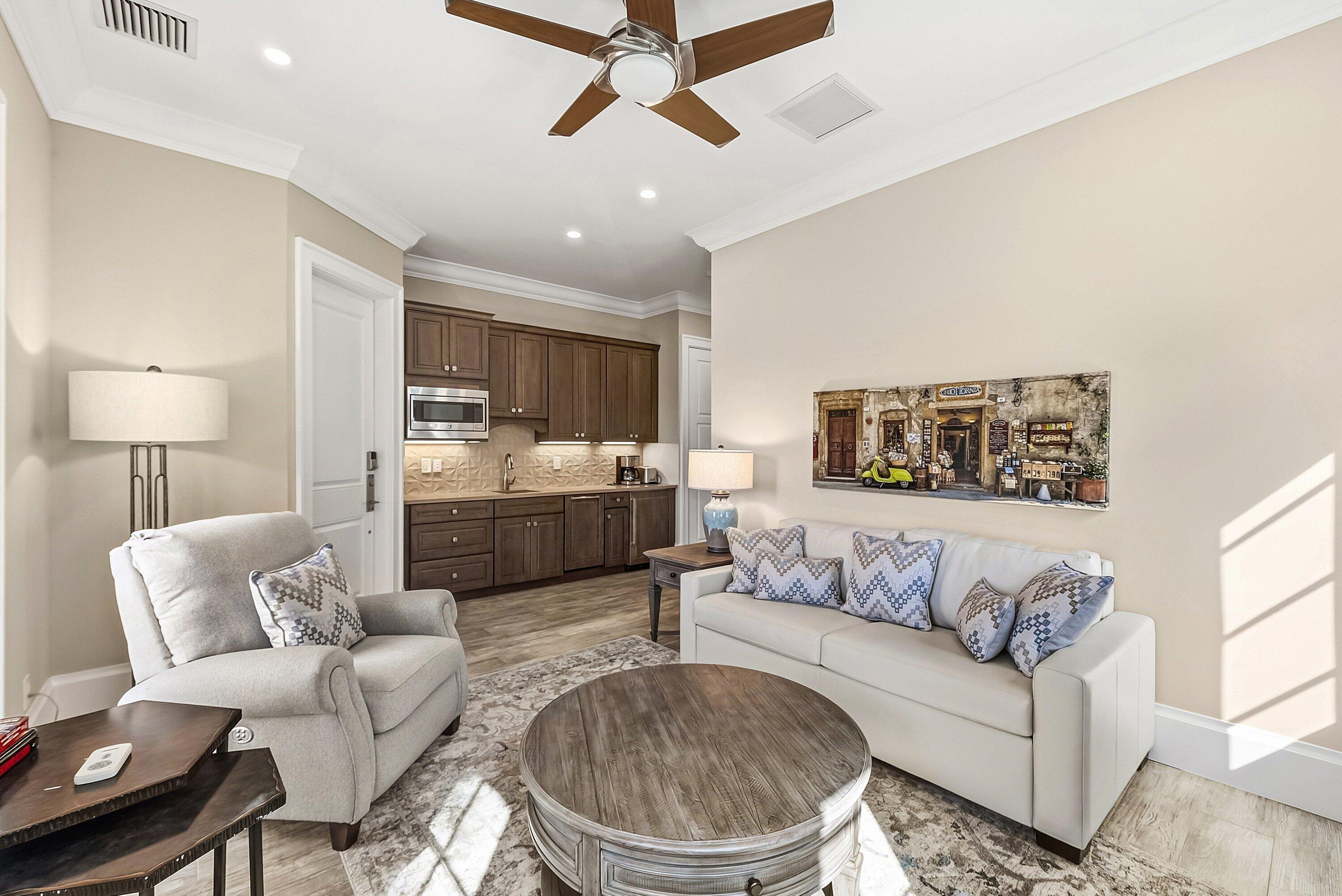 201 Northeast 3rd Court Boca Raton, FL 33432 - Photo 39 of 84 a living room with furniture and a chandelier