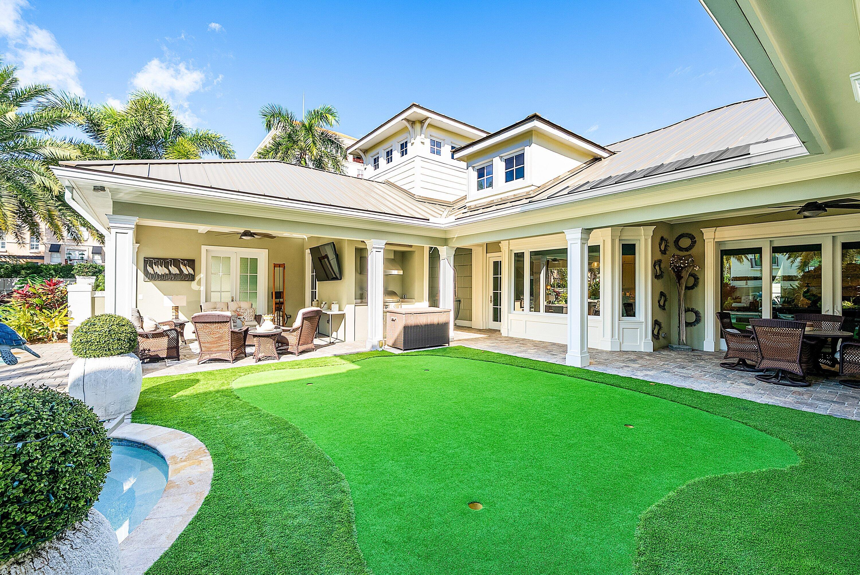 201 Northeast 3rd Court Boca Raton, FL 33432 - Photo 46 of 84 a view of a house with a backyard and porch