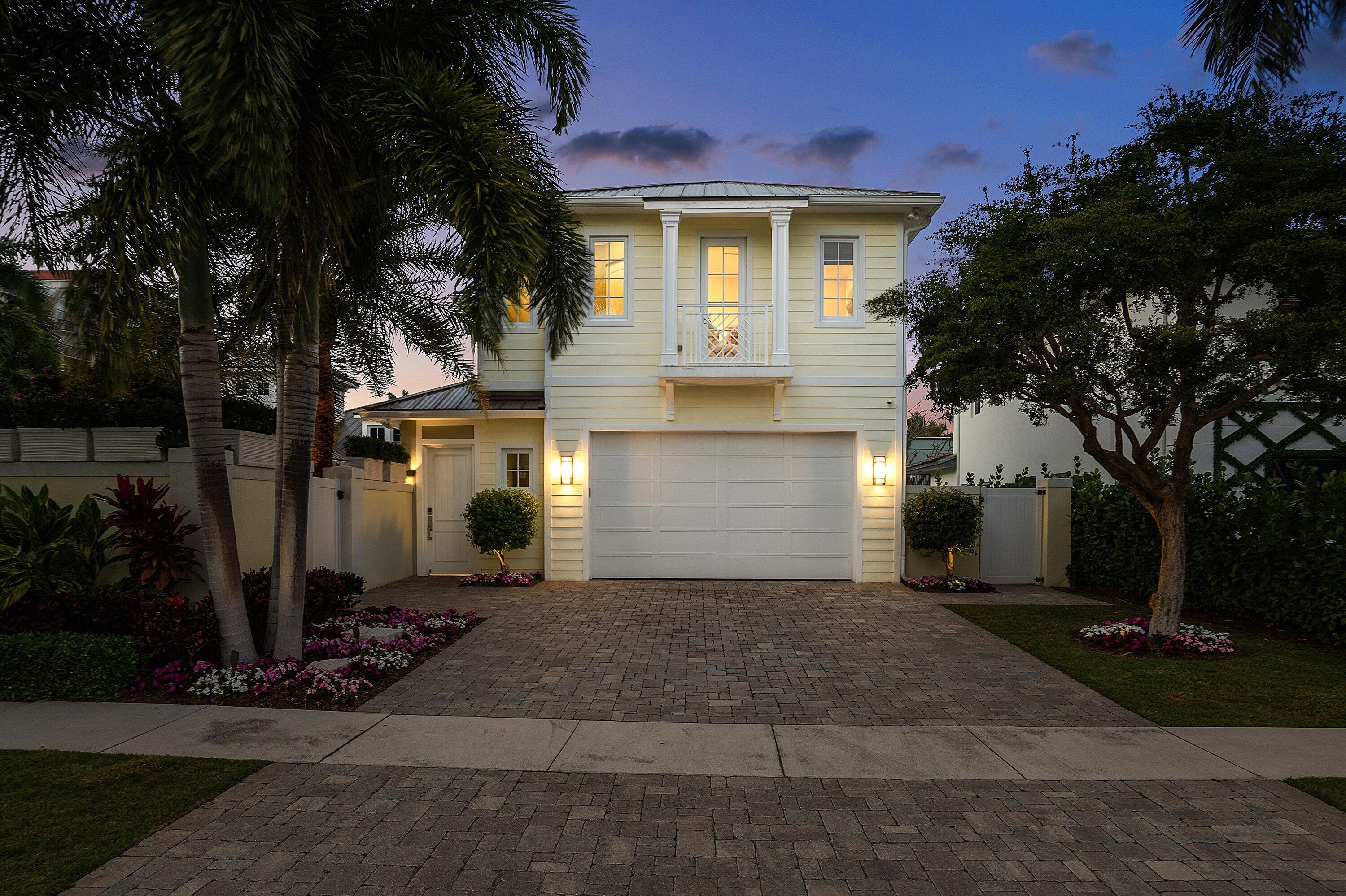 201 Northeast 3rd Court Boca Raton, FL 33432 - Photo 68 of 84 a front view of a house with a yard and garage