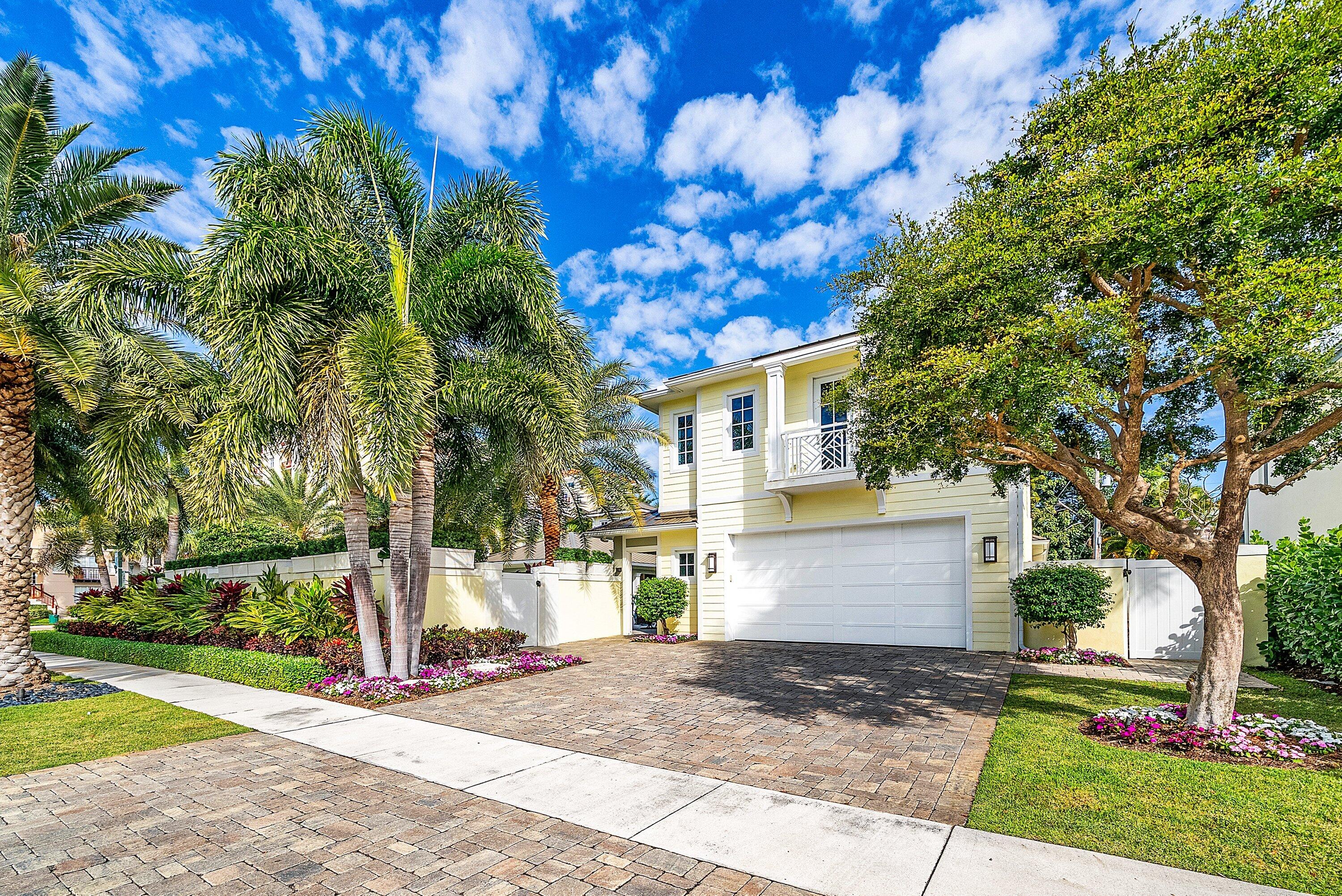 201 Northeast 3rd Court Boca Raton, FL 33432 - Photo 7 of 84 a view of a white house with a tree