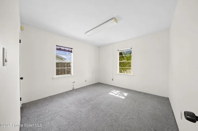 an empty room with windows