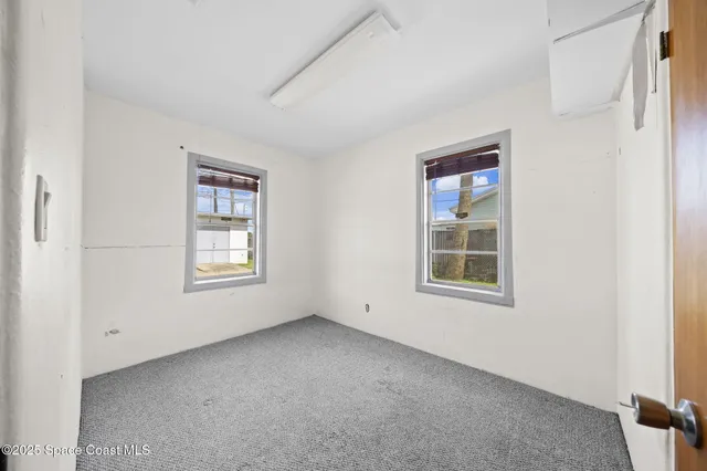 an empty room with windows