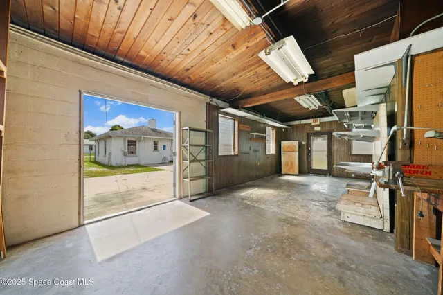a view of a hallway with wooden area