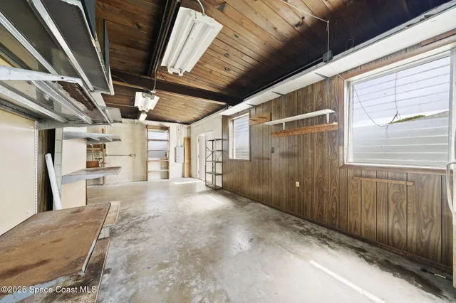 a view of a room with wooden walls