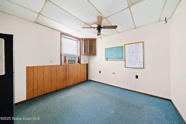 a bathroom with a toilet a sink and a window