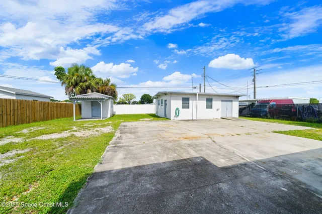 a house with swimming pool in front of it