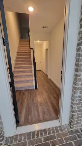 a view of entryway with wooden floor