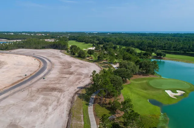 a view of a lake with a yard