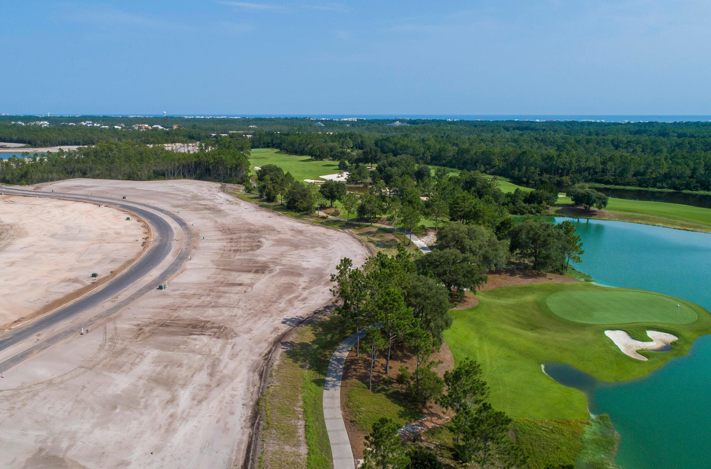 Lot 81 Windsong Dr Inlet Beach Inlet Beach, FL 32461 - Photo 1 of 4 a view of a lake with a yard