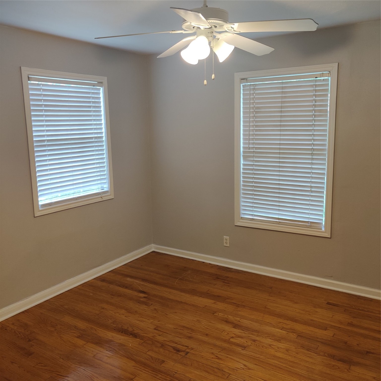919 Oak Meadows Street Houston, TX 77017 - Photo 11 of 12 a view of a room with wooden floor and a window