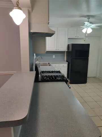 a kitchen with a cabinets and appliances