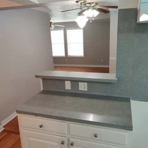 a close view of a sink a mirror and a window